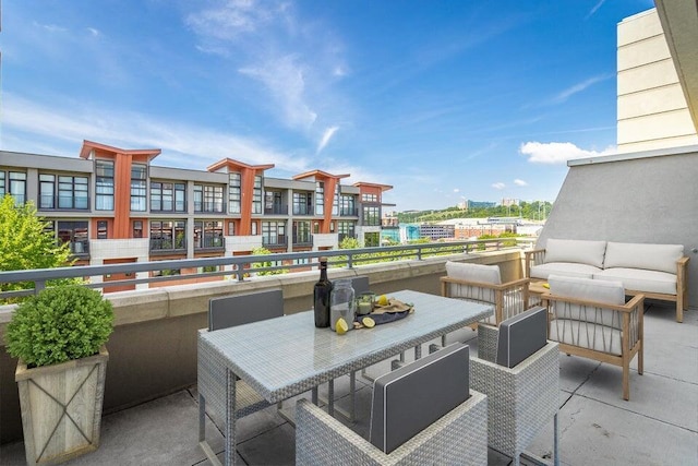 view of patio with a balcony and an outdoor hangout area