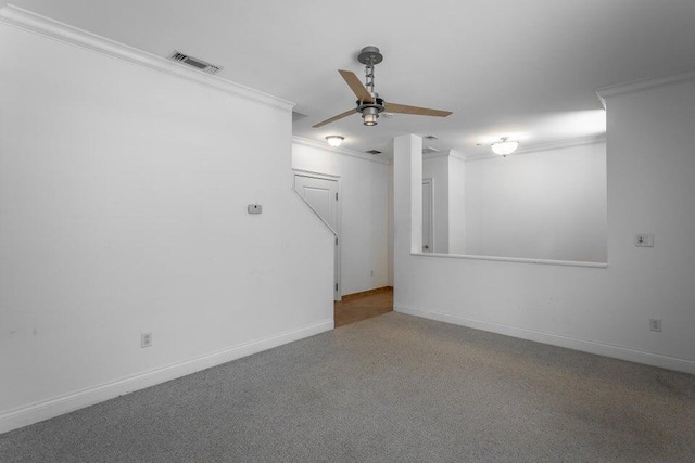 interior space with ceiling fan and crown molding