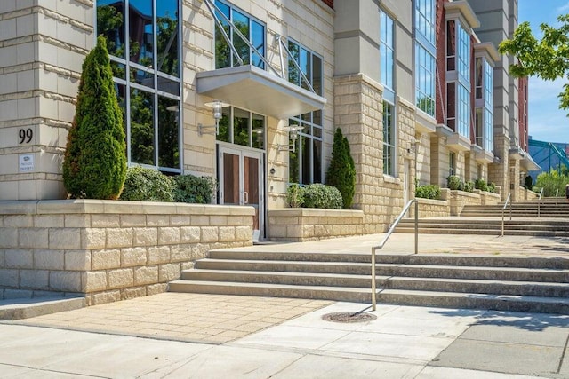 view of exterior entry featuring french doors