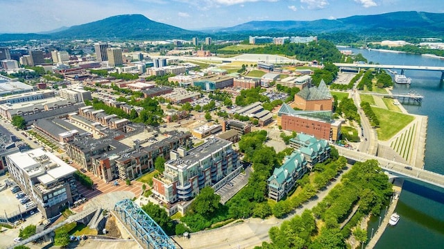 bird's eye view with a water and mountain view