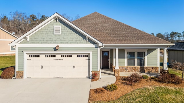 craftsman-style home with a porch and a garage