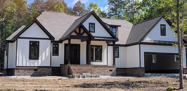 3069 Poe Rd, Soddy Daisy, TN 37379 - view of front of house with a shingled roof and brick siding