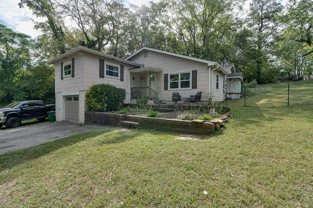 view of front of property with a garage and a front lawn