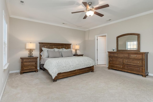 bedroom featuring ceiling fan, crown molding, and light colored carpet