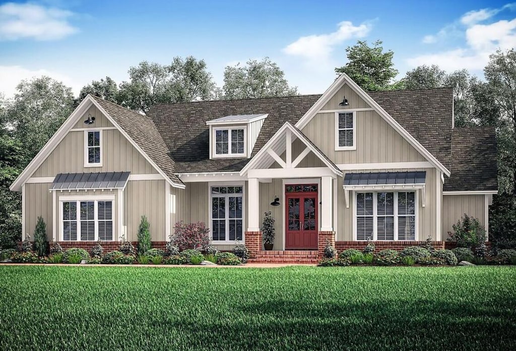 craftsman-style house featuring french doors, board and batten siding, roof with shingles, a front yard, and brick siding