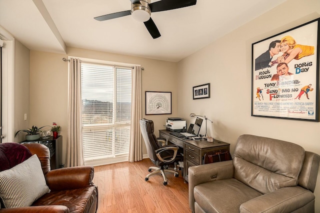 office space with light wood-type flooring and ceiling fan