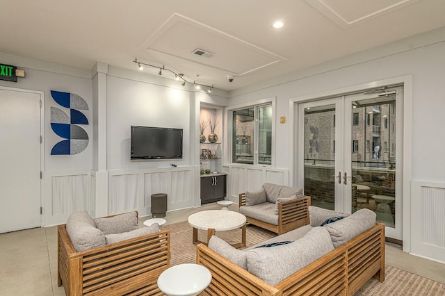 living room with french doors and tile patterned floors