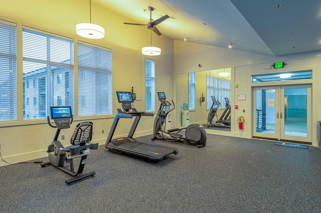 workout area with high vaulted ceiling, ceiling fan, and french doors