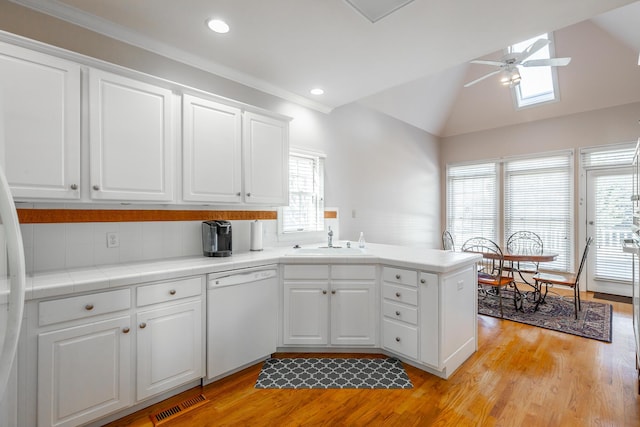 kitchen featuring dishwasher, white cabinets, sink, ceiling fan, and light hardwood / wood-style floors