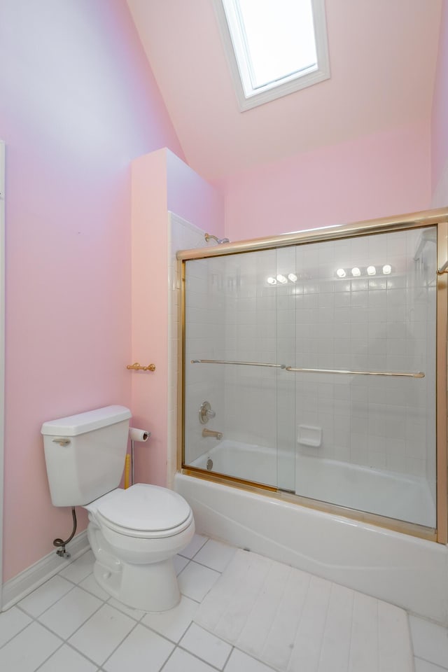 bathroom featuring combined bath / shower with glass door, tile patterned flooring, vaulted ceiling, and toilet