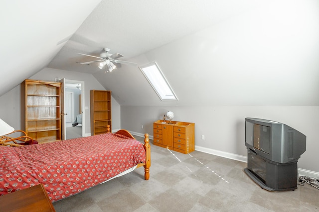 bedroom featuring ceiling fan and lofted ceiling with skylight