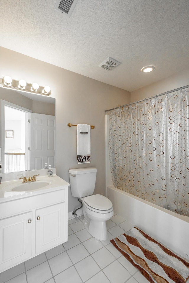 full bathroom featuring tile patterned flooring, vanity, shower / bathtub combination with curtain, and a textured ceiling