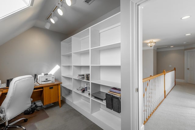 carpeted home office featuring vaulted ceiling