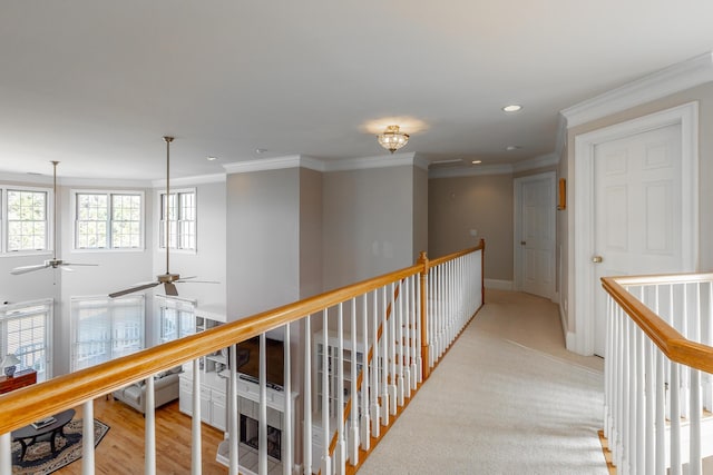 hall with ornamental molding and a notable chandelier