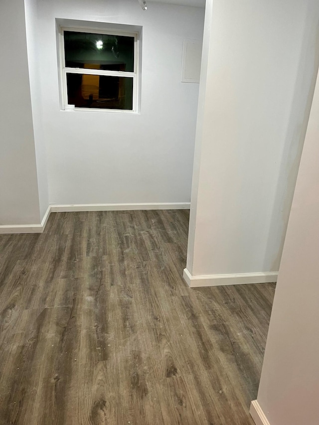 spare room with dark hardwood / wood-style flooring