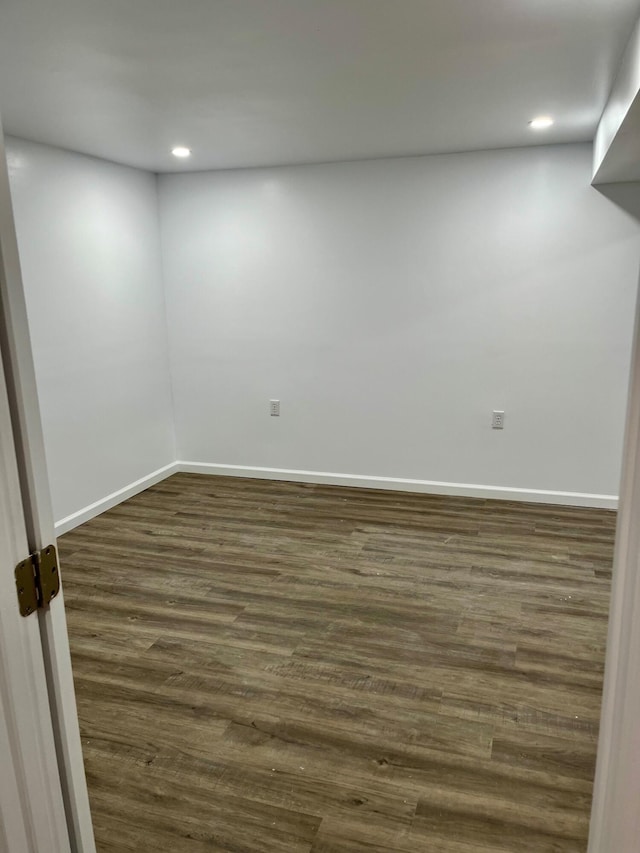 basement with dark wood-type flooring