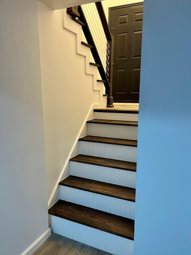 stairway with wood-type flooring