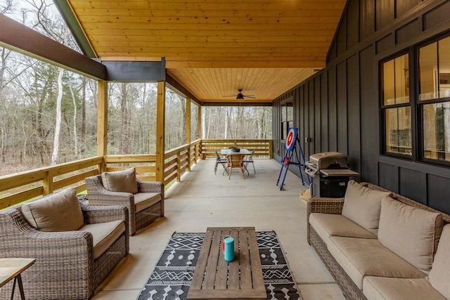 sunroom featuring wood ceiling and vaulted ceiling