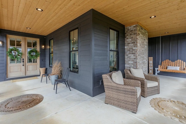 view of patio / terrace featuring french doors and a porch