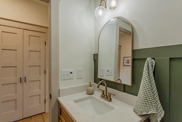 bathroom with wood-type flooring and vanity