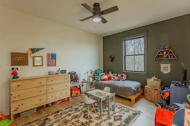 bedroom featuring ceiling fan and light hardwood / wood-style floors