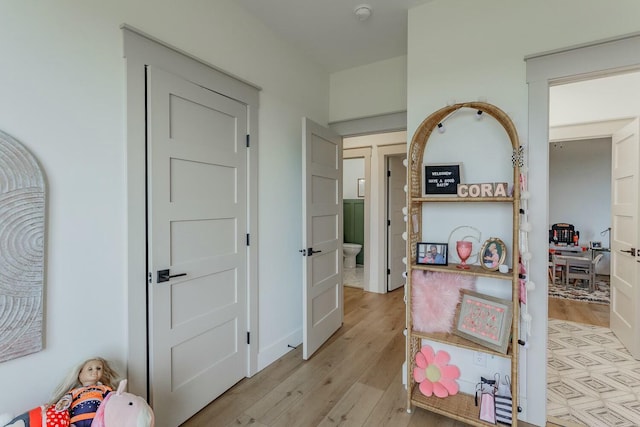 corridor featuring light hardwood / wood-style floors