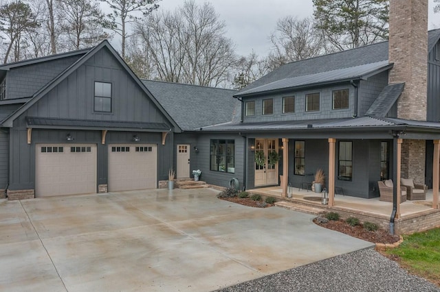 view of front of home featuring a porch and a garage