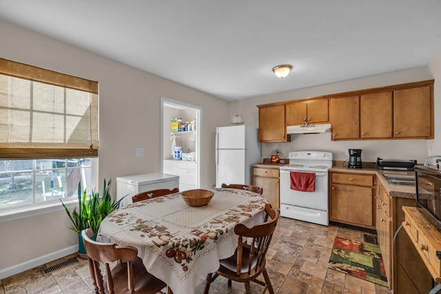 kitchen with white appliances and sink