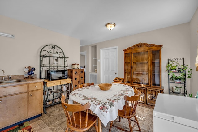 dining space with sink