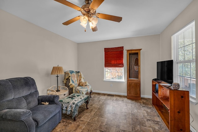 living area with ceiling fan