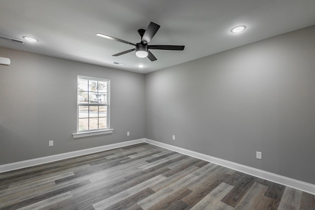 unfurnished room featuring ceiling fan and hardwood / wood-style flooring