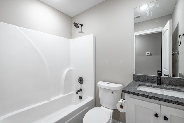 full bathroom featuring toilet, vanity, and bathtub / shower combination