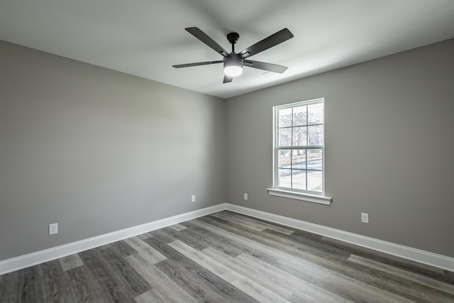 unfurnished room with ceiling fan and wood-type flooring