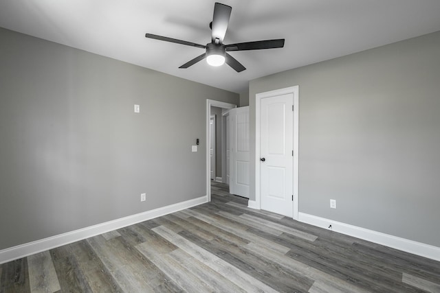 unfurnished bedroom featuring ceiling fan and hardwood / wood-style floors