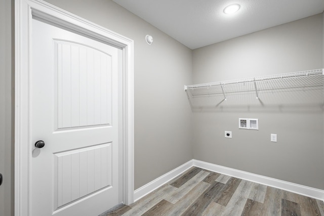 clothes washing area featuring washer hookup, hardwood / wood-style floors, and hookup for an electric dryer