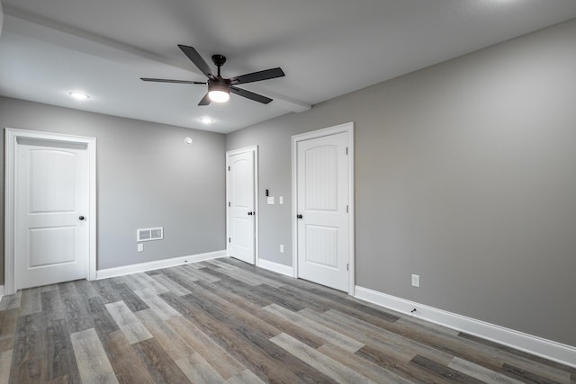 unfurnished room featuring ceiling fan and hardwood / wood-style flooring