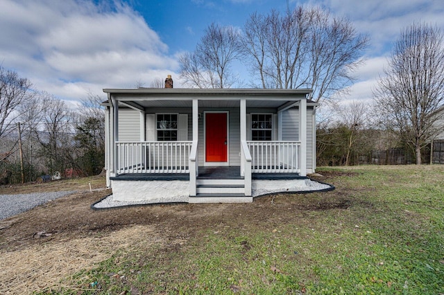 view of front of home featuring a front lawn and a porch