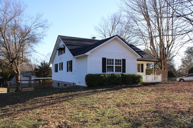 view of property exterior with a yard