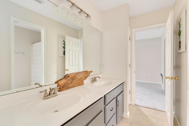 bathroom with vanity and tile patterned flooring