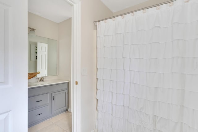 bathroom featuring tile patterned flooring and vanity