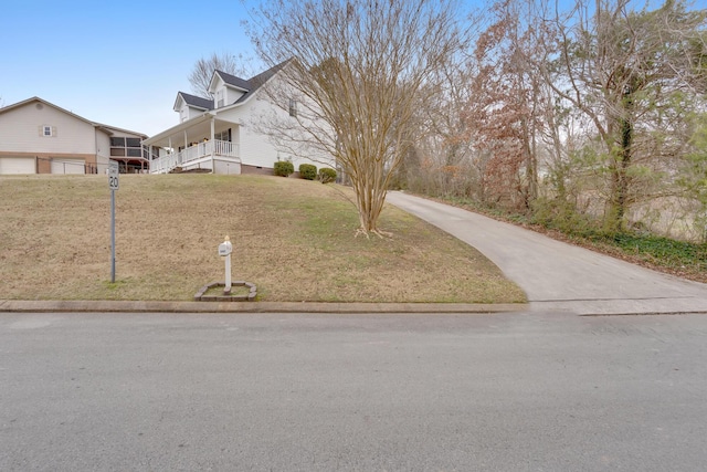 exterior space featuring a yard and a porch