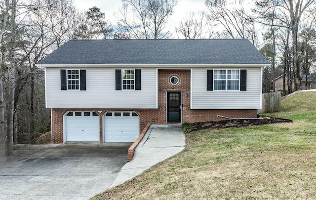 split foyer home featuring a front yard and a garage