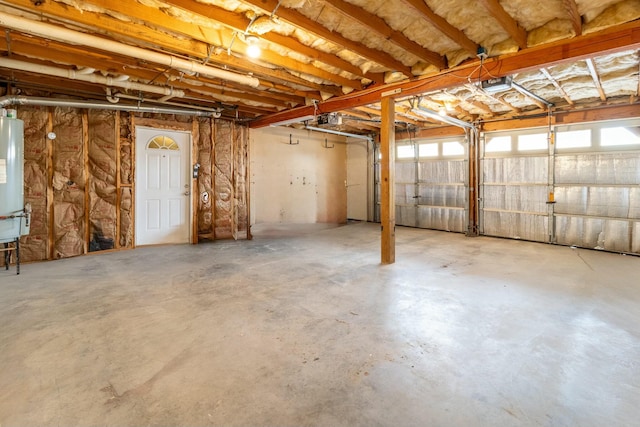 garage with a garage door opener and gas water heater