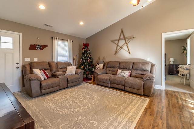 living room featuring hardwood / wood-style floors and lofted ceiling