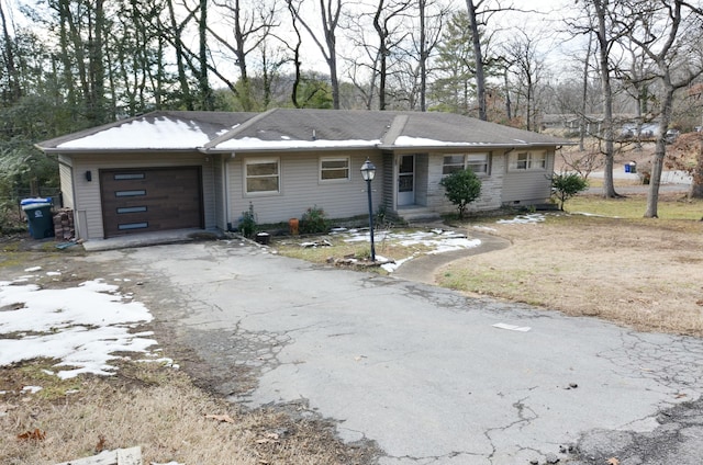 ranch-style house featuring a garage