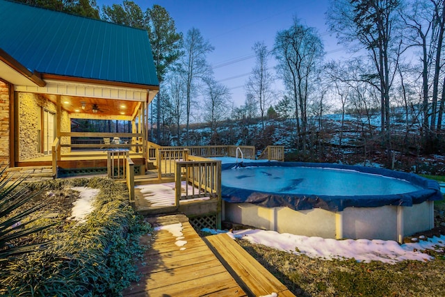 view of swimming pool featuring a wooden deck