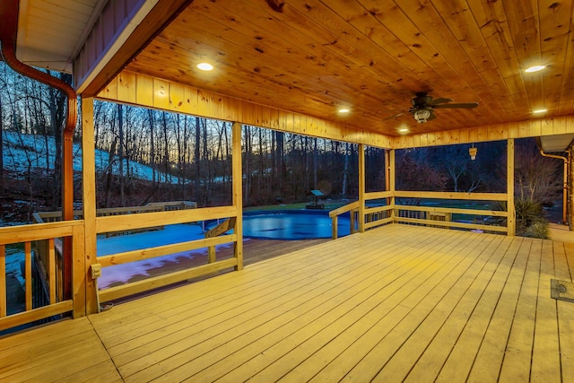 wooden deck with a pool