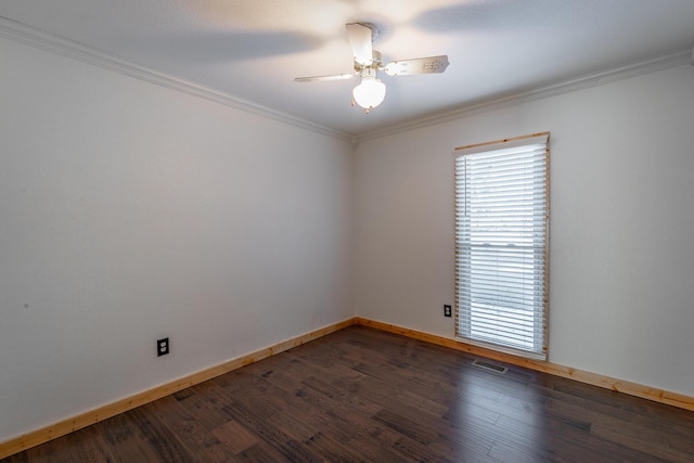 unfurnished room featuring ceiling fan, dark wood-type flooring, and crown molding