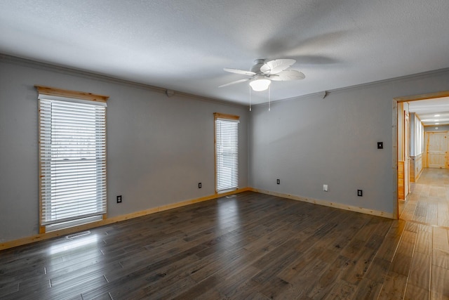 spare room with ceiling fan, dark hardwood / wood-style flooring, and crown molding