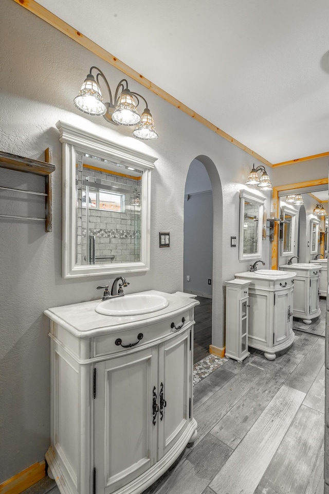 bathroom featuring vanity and ornamental molding